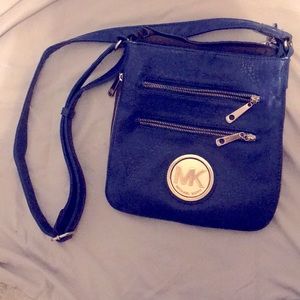 Michael Kors royal blue cross body purse.